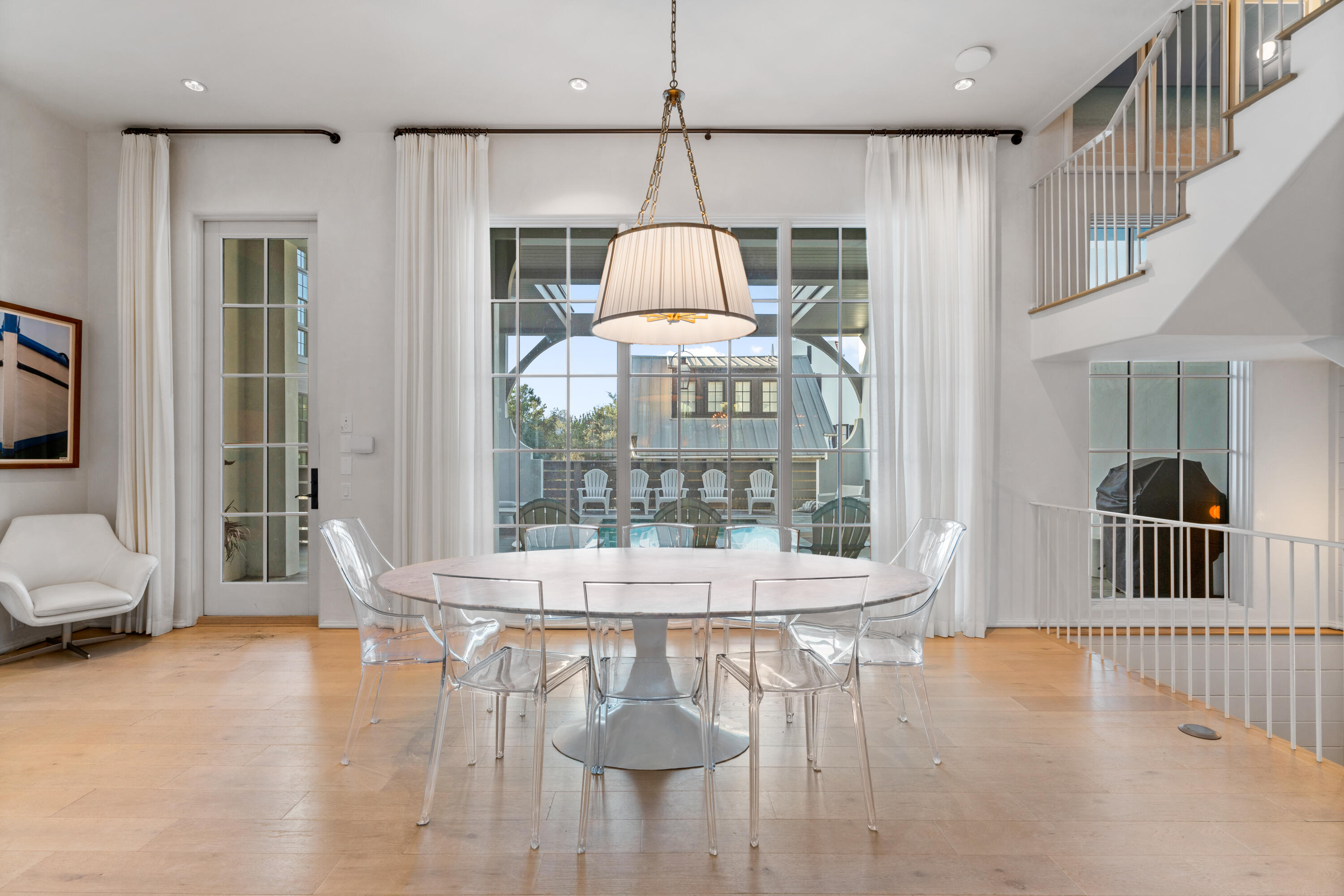 16 South Barrett Square, Unit 5 Rosemary Beach, FL 32461 - Photo 21 of 100 a view of a dining room with furniture window and wooden floor