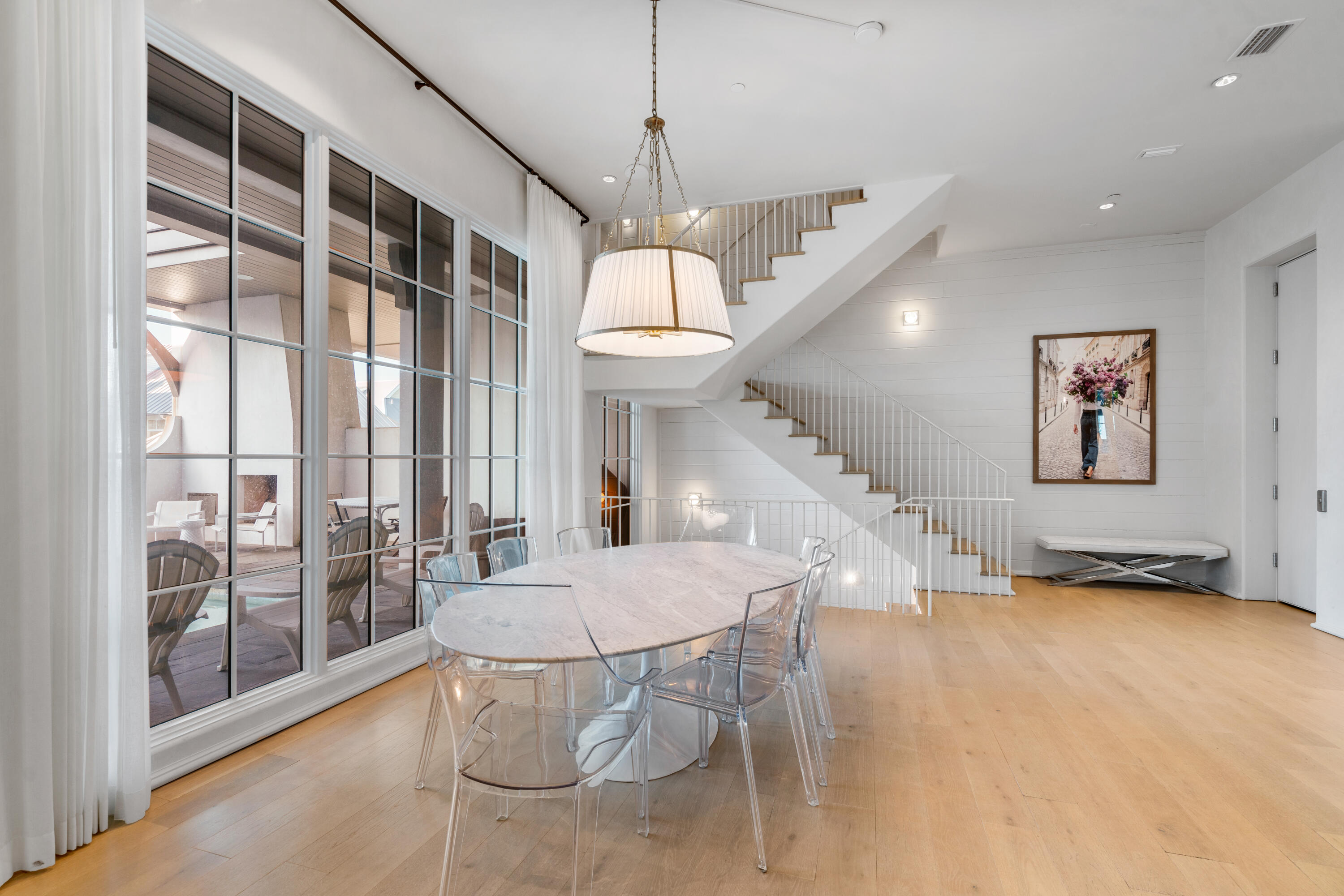 16 South Barrett Square, Unit 5 Rosemary Beach, FL 32461 - Photo 22 of 100 a dining room with furniture and a chandelier