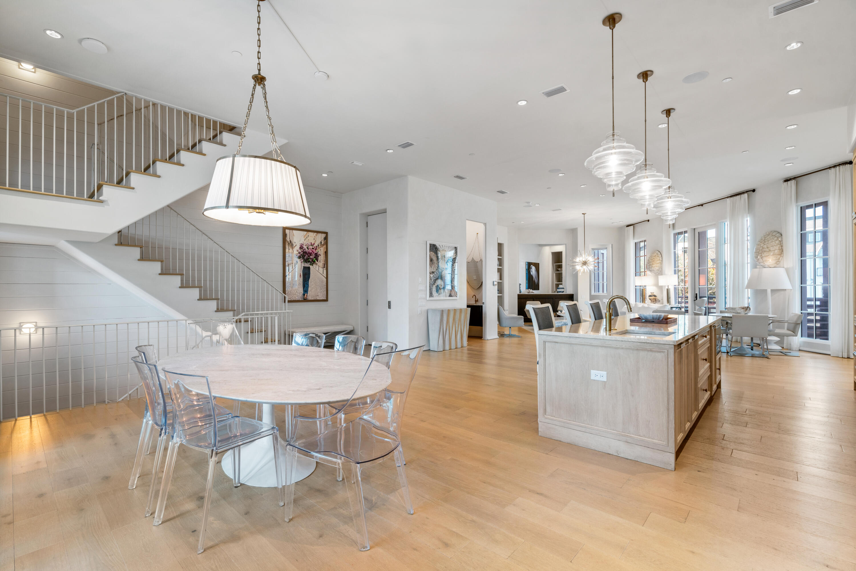 16 South Barrett Square, Unit 5 Rosemary Beach, FL 32461 - Photo 23 of 100 a view of a dining room and livingroom with furniture wooden floor a chandelier