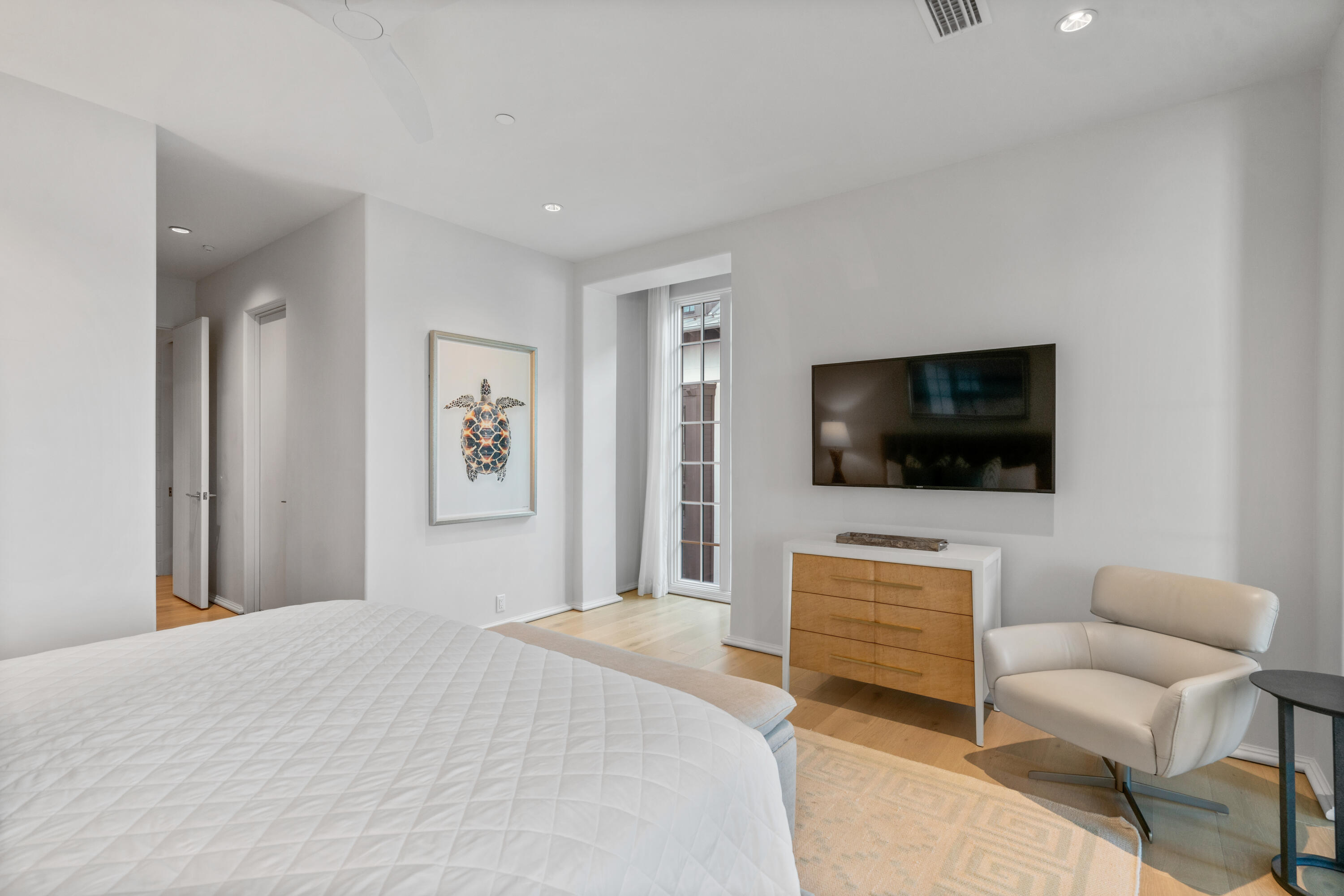 16 South Barrett Square, Unit 5 Rosemary Beach, FL 32461 - Photo 35 of 100 a bedroom with a bed and a flat screen tv