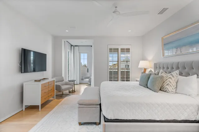 a bedroom with a bed and a lamp