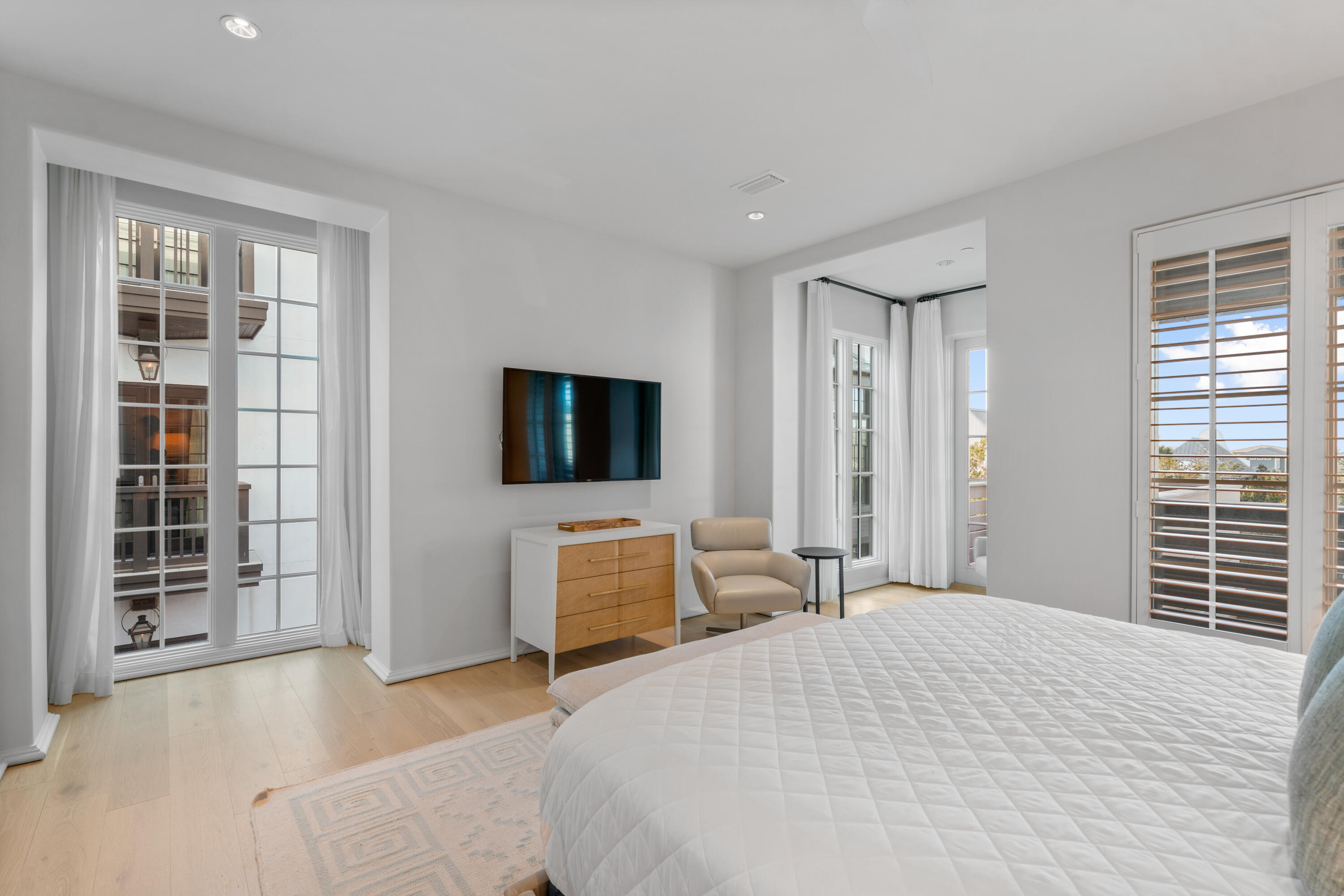 16 South Barrett Square, Unit 5 Rosemary Beach, FL 32461 - Photo 37 of 100 a bedroom with a bed and a flat screen tv