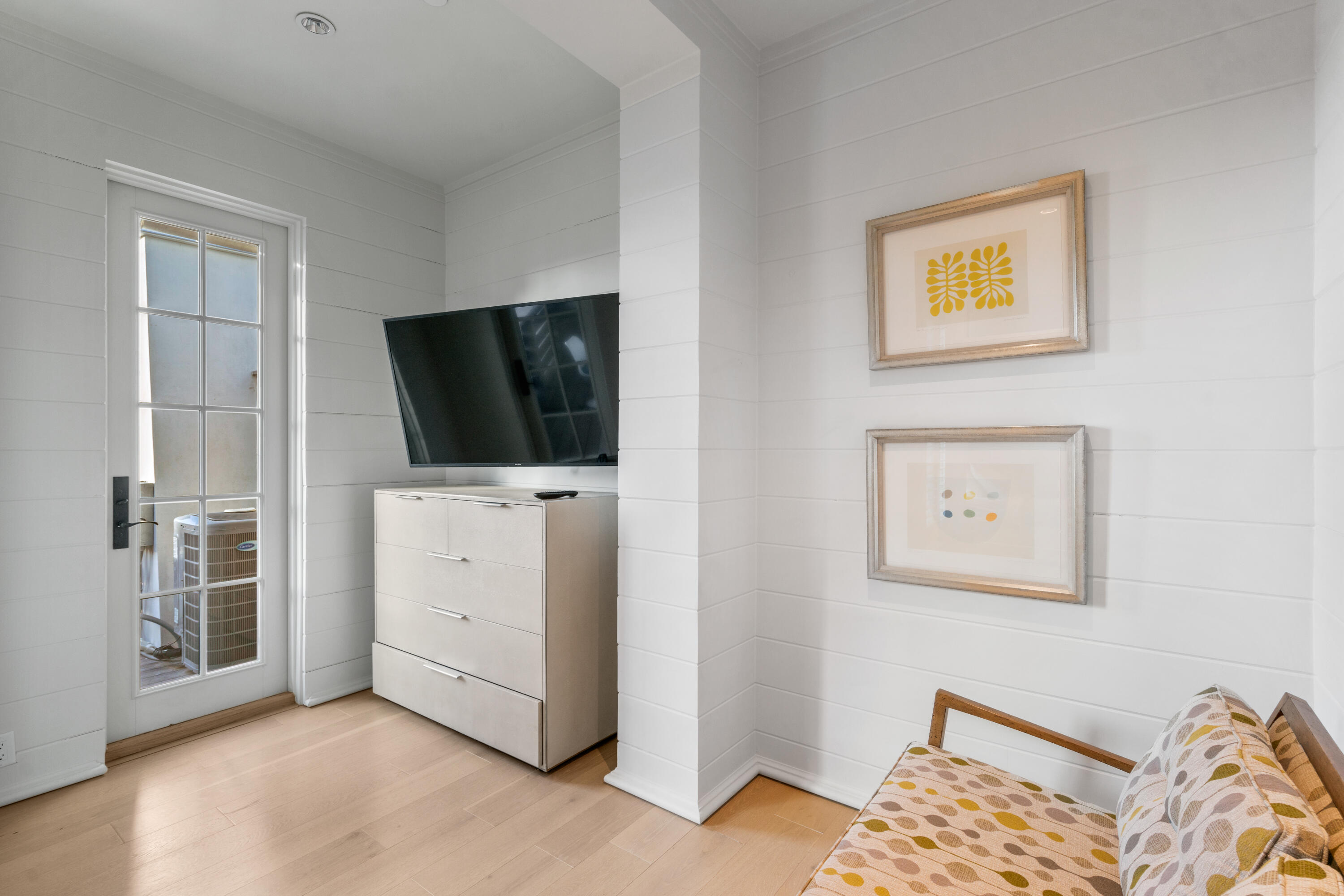 16 South Barrett Square, Unit 5 Rosemary Beach, FL 32461 - Photo 41 of 100 a room with a bed and a flat screen tv