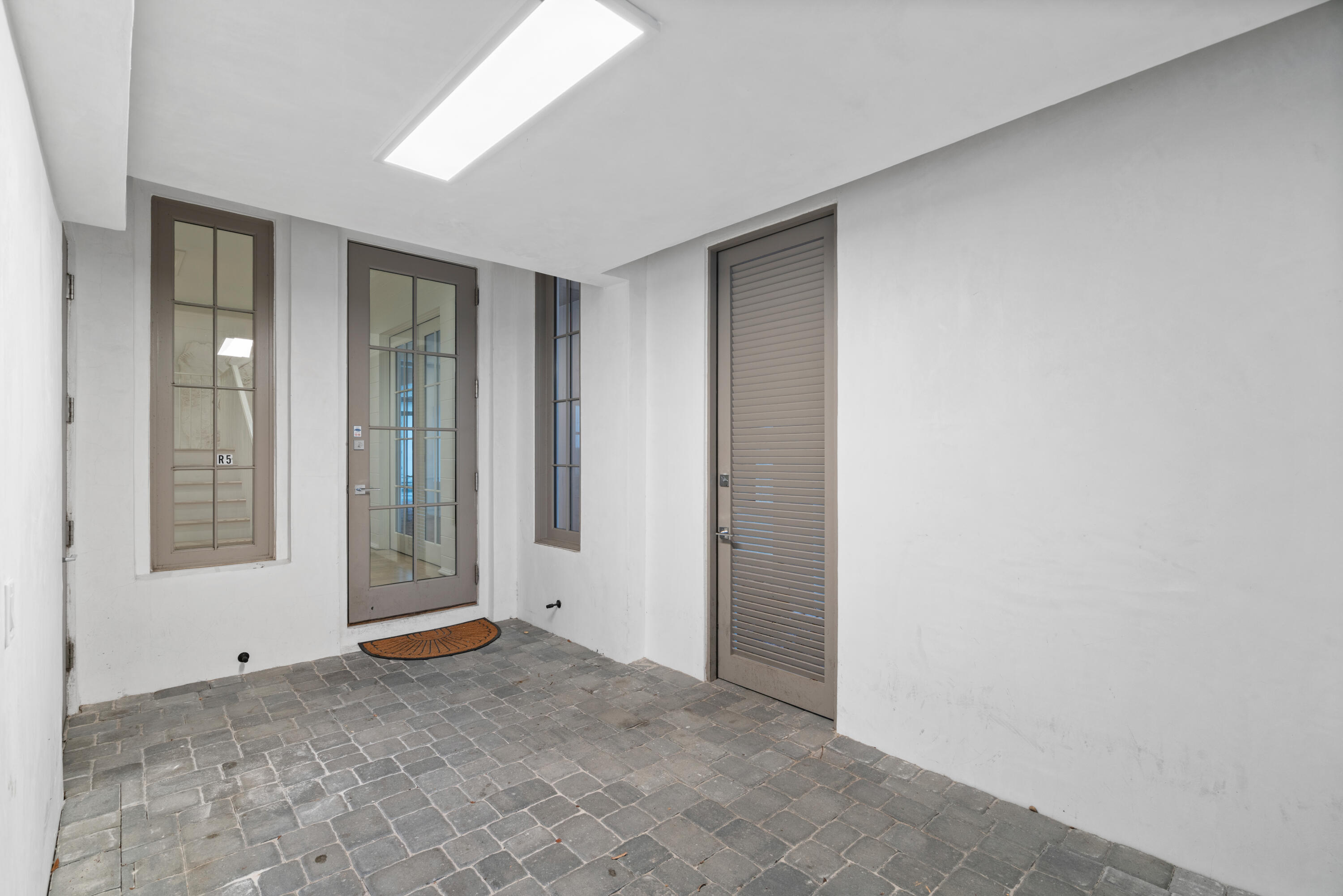 16 South Barrett Square, Unit 5 Rosemary Beach, FL 32461 - Photo 6 of 100 a view of an empty room with window and bathroom