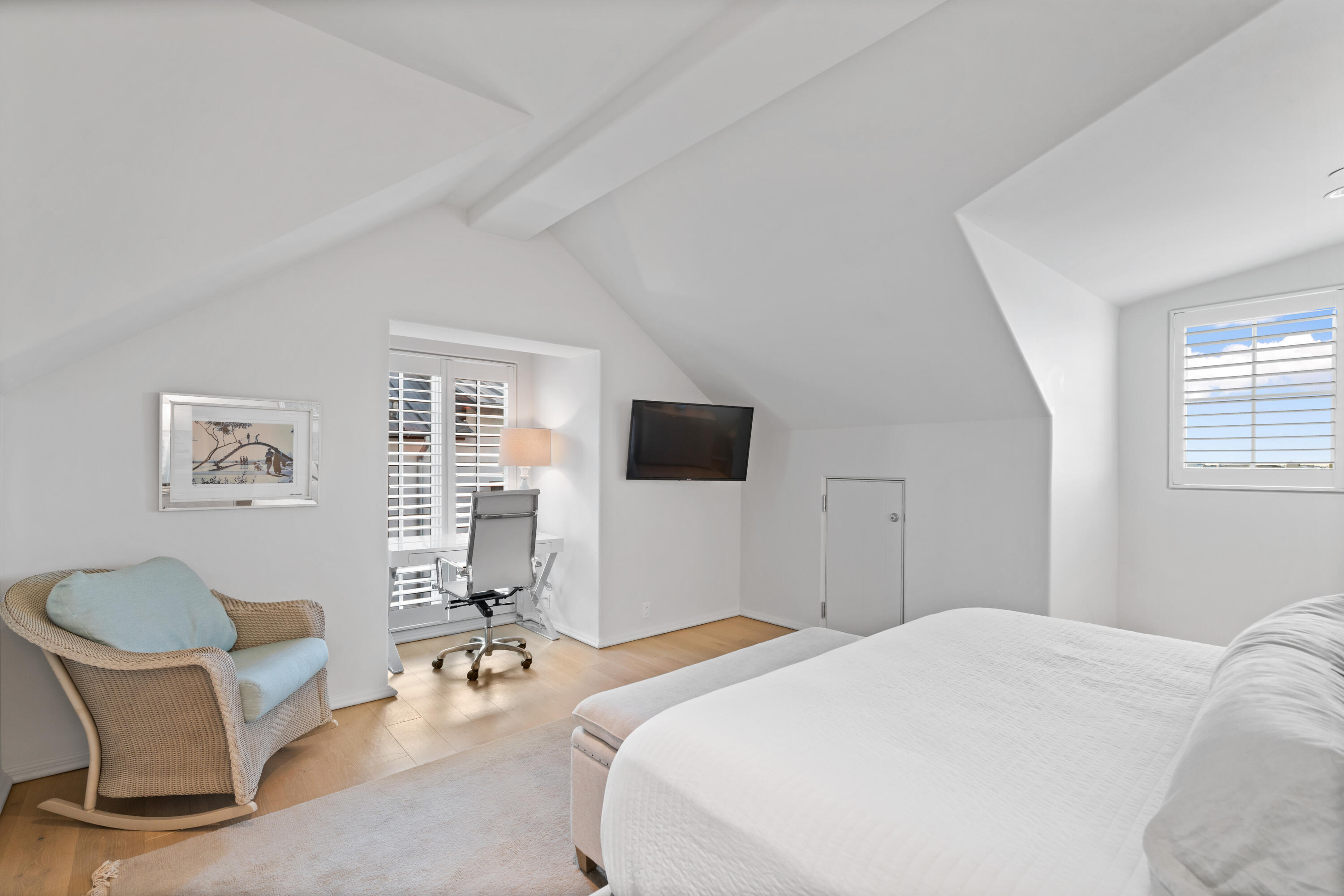 16 South Barrett Square, Unit 5 Rosemary Beach, FL 32461 - Photo 61 of 100 a bedroom with a bed and a chair