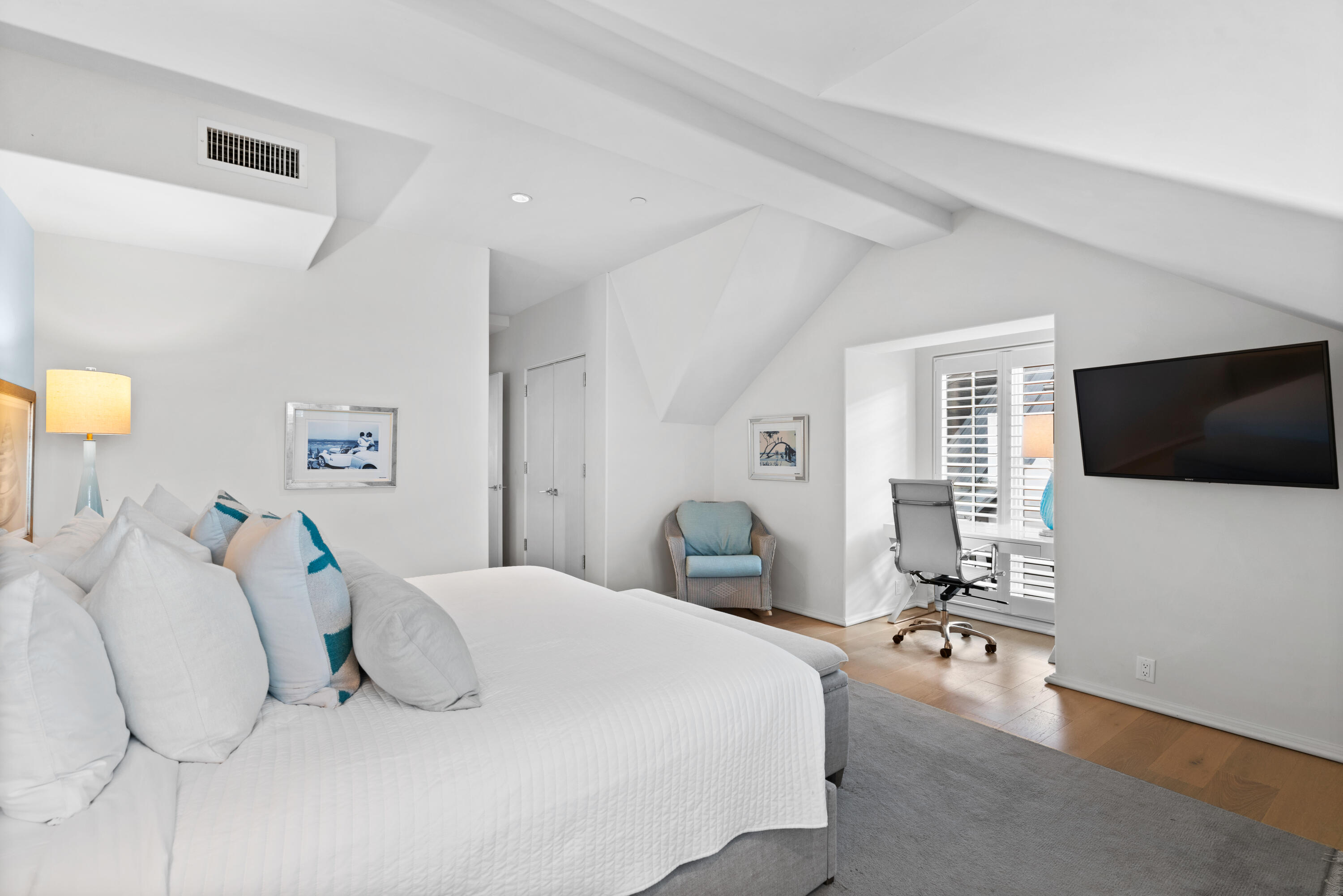 16 South Barrett Square, Unit 5 Rosemary Beach, FL 32461 - Photo 62 of 100 a bedroom with a bed and a flat screen tv