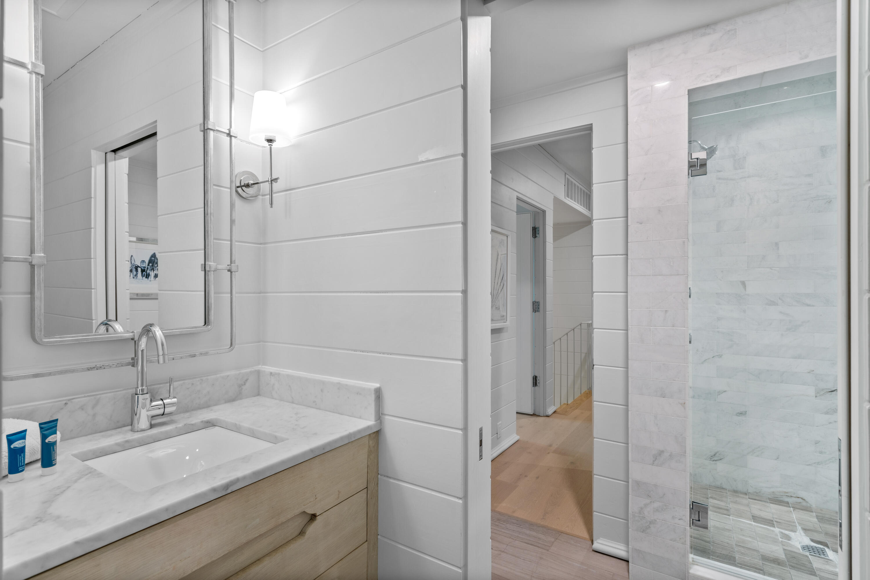 16 South Barrett Square, Unit 5 Rosemary Beach, FL 32461 - Photo 69 of 100 a bathroom with a granite countertop sink shower and a mirror