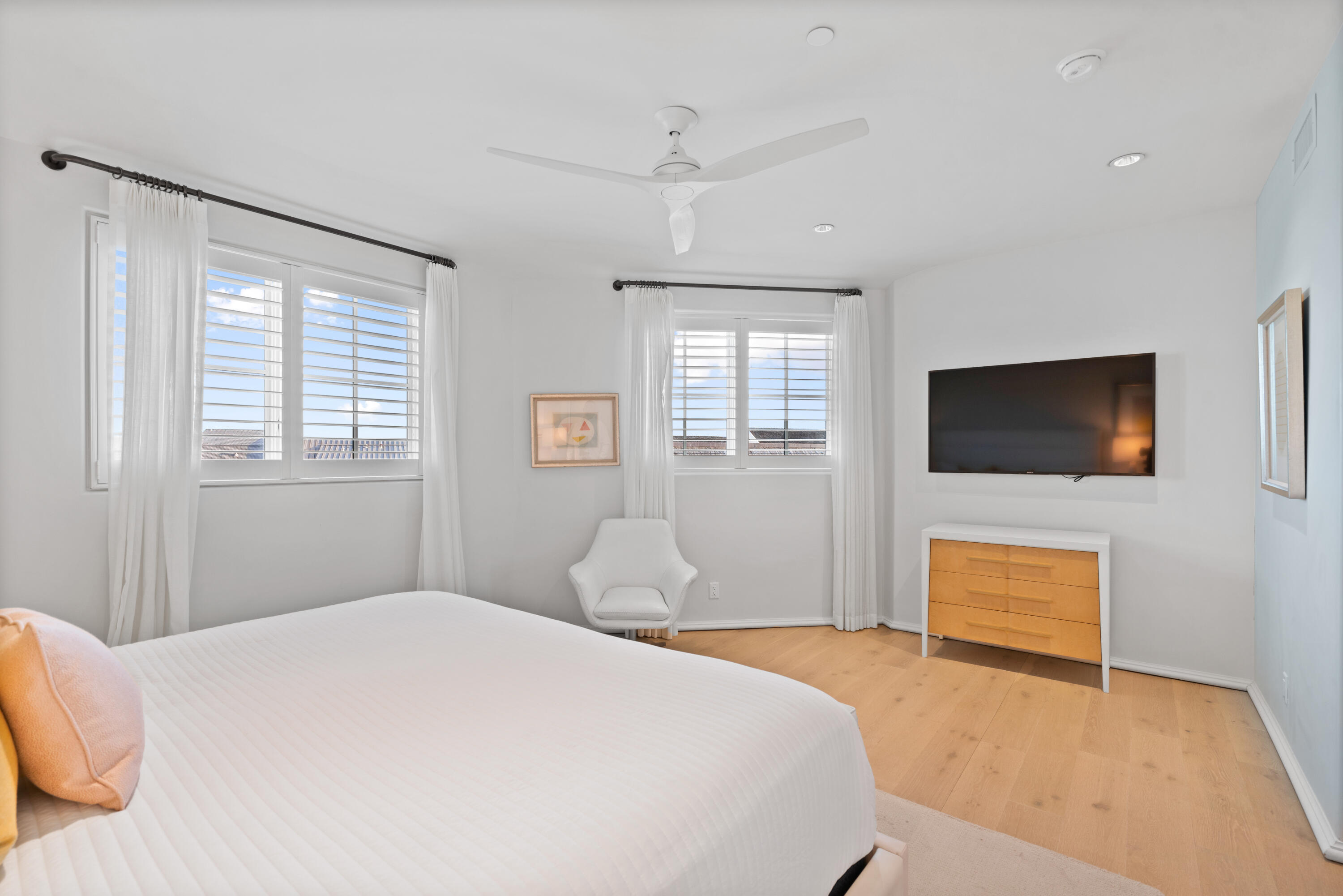 16 South Barrett Square, Unit 5 Rosemary Beach, FL 32461 - Photo 73 of 100 a bedroom with a bed and a flat screen tv