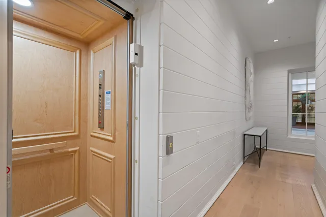 a dining room with furniture and a chandelier