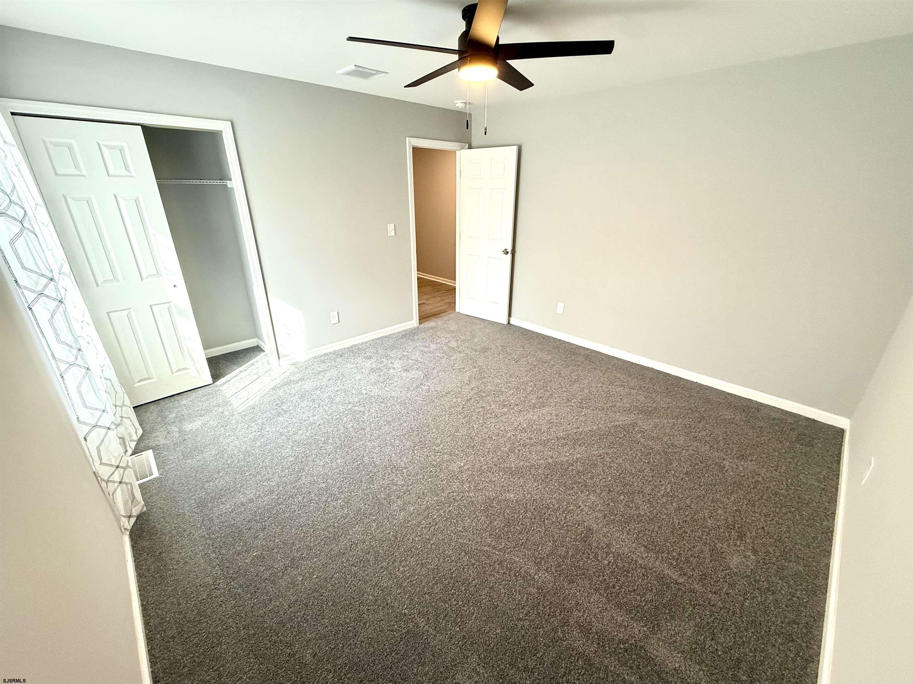 607 Sea Ranch Avenue Mays Landing, NJ 08330 - Photo 11 of 23 a view of a big room with closet and windows