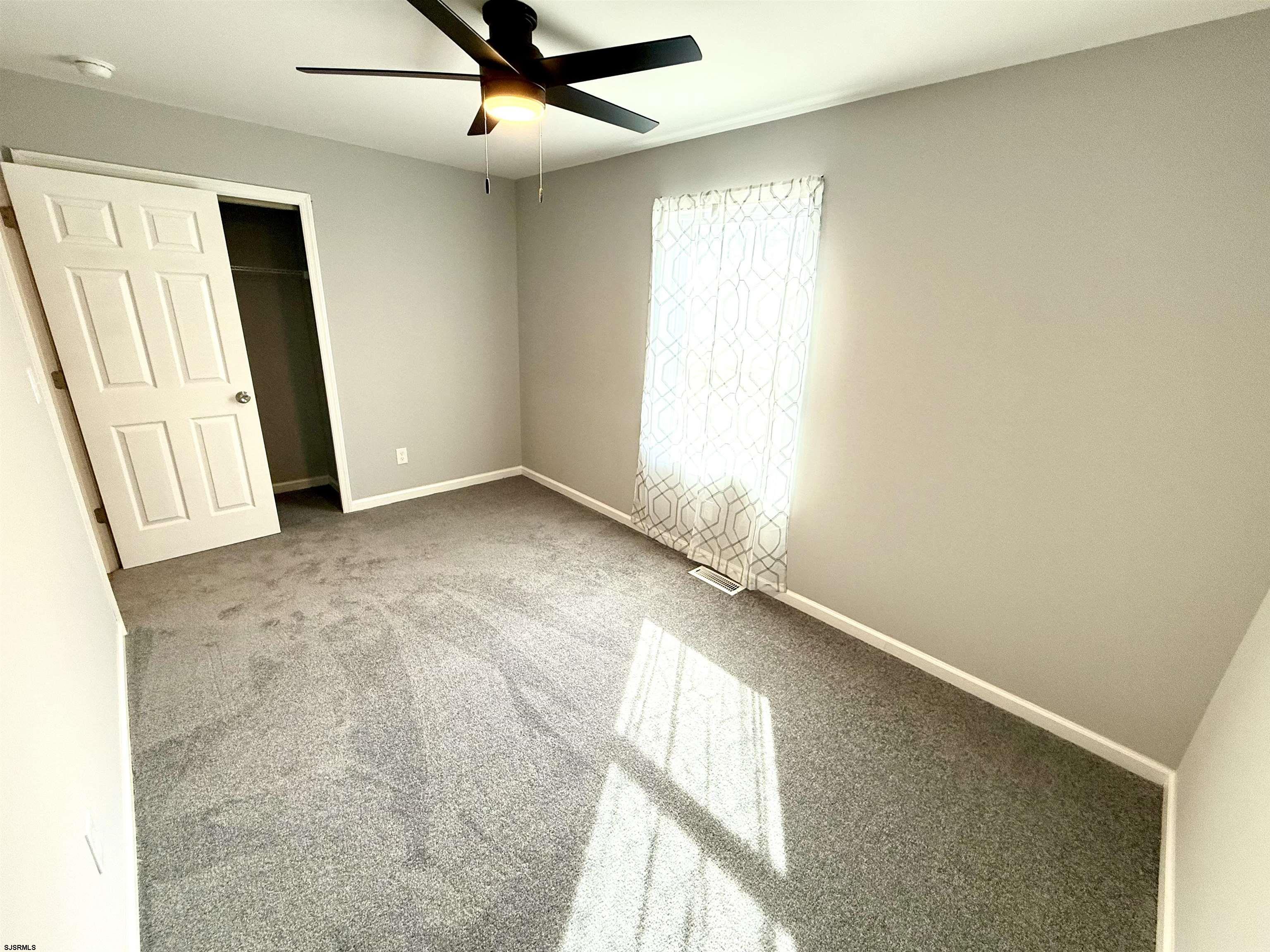 607 Sea Ranch Avenue Mays Landing, NJ 08330 - Photo 15 of 23 an empty room with windows