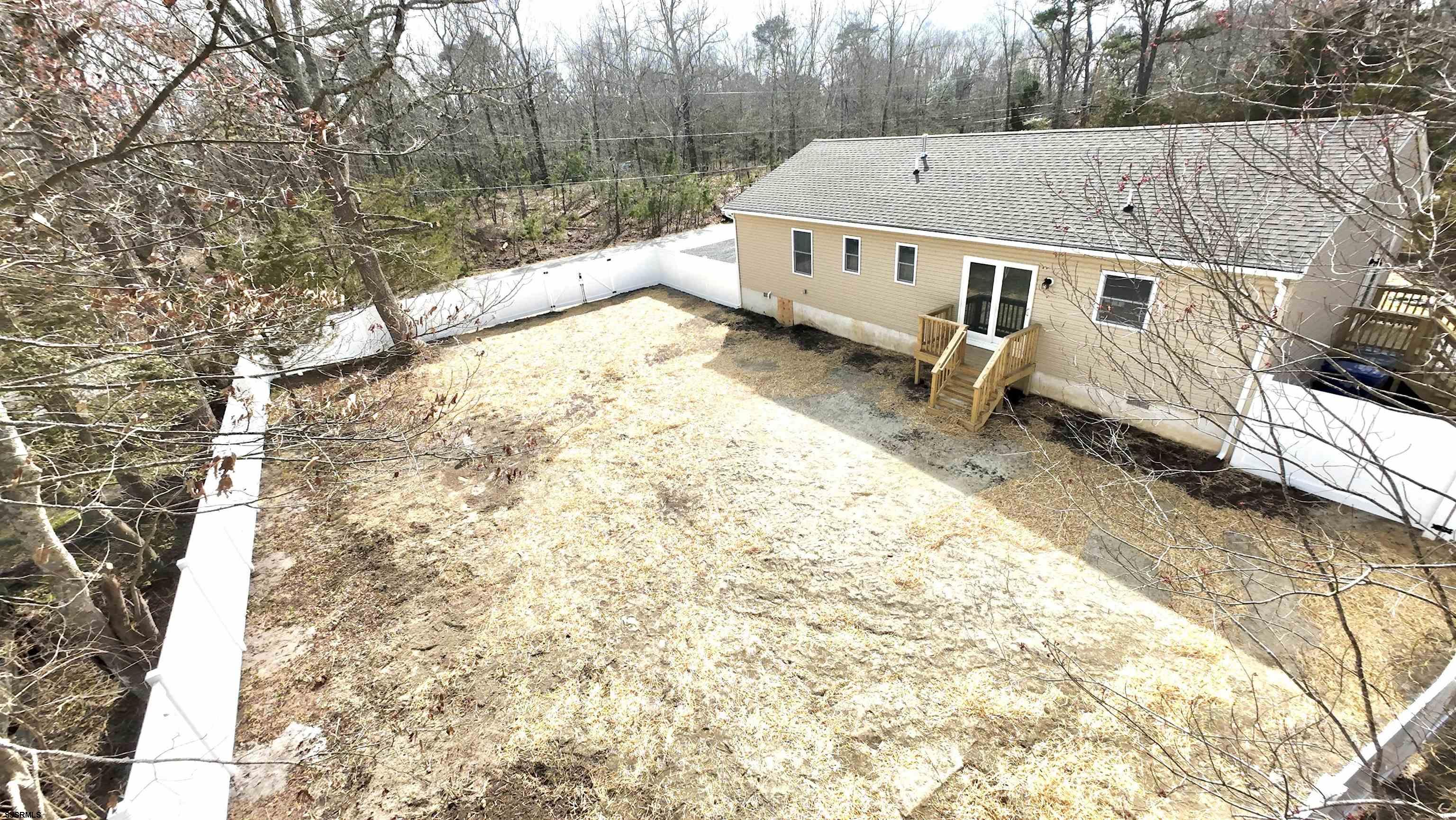 607 Sea Ranch Avenue Mays Landing, NJ 08330 - Photo 21 of 23 a view of balcony with wooden floor and fence
