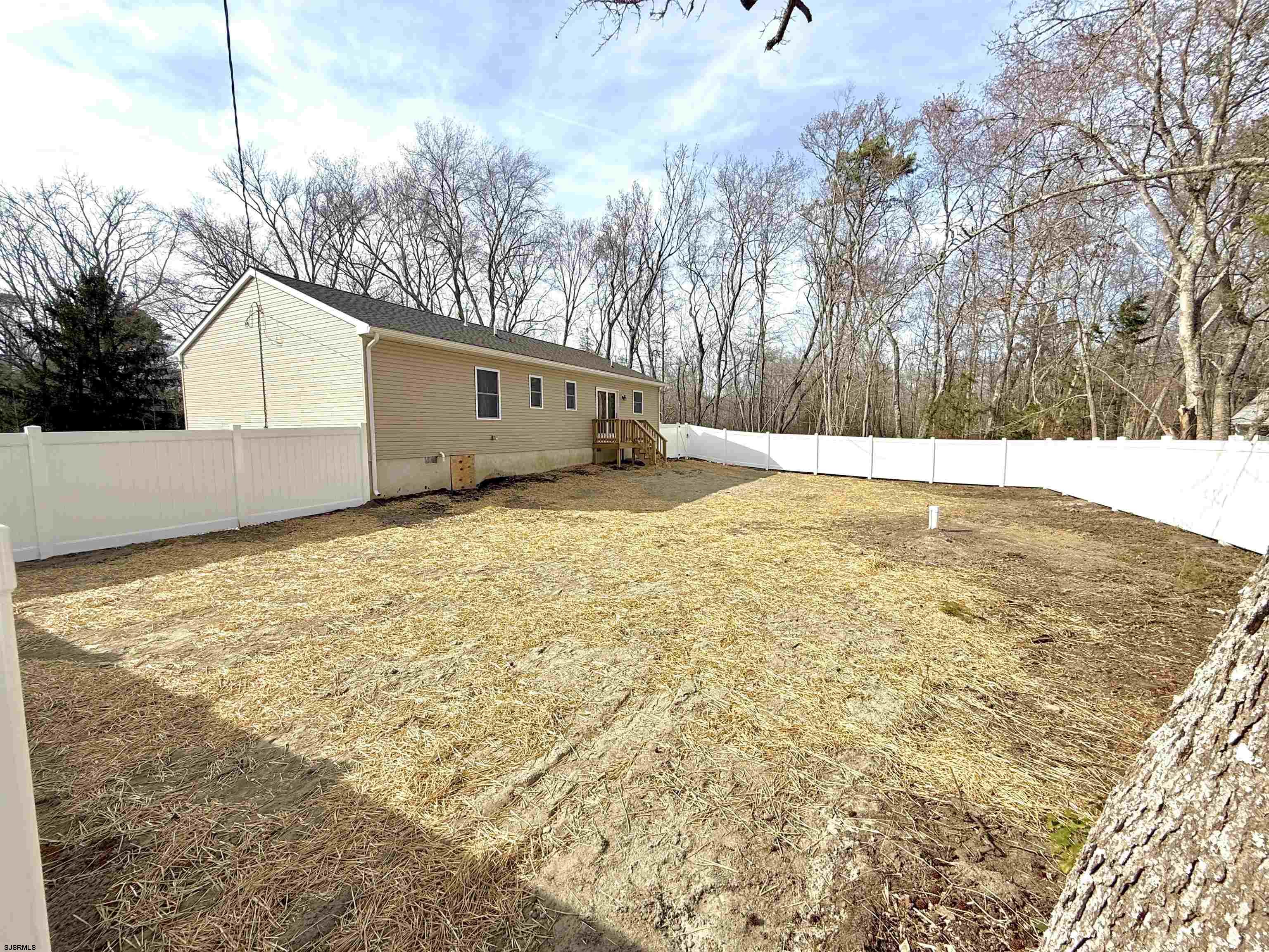 607 Sea Ranch Avenue Mays Landing, NJ 08330 - Photo 22 of 23 a view of a yard with a tree