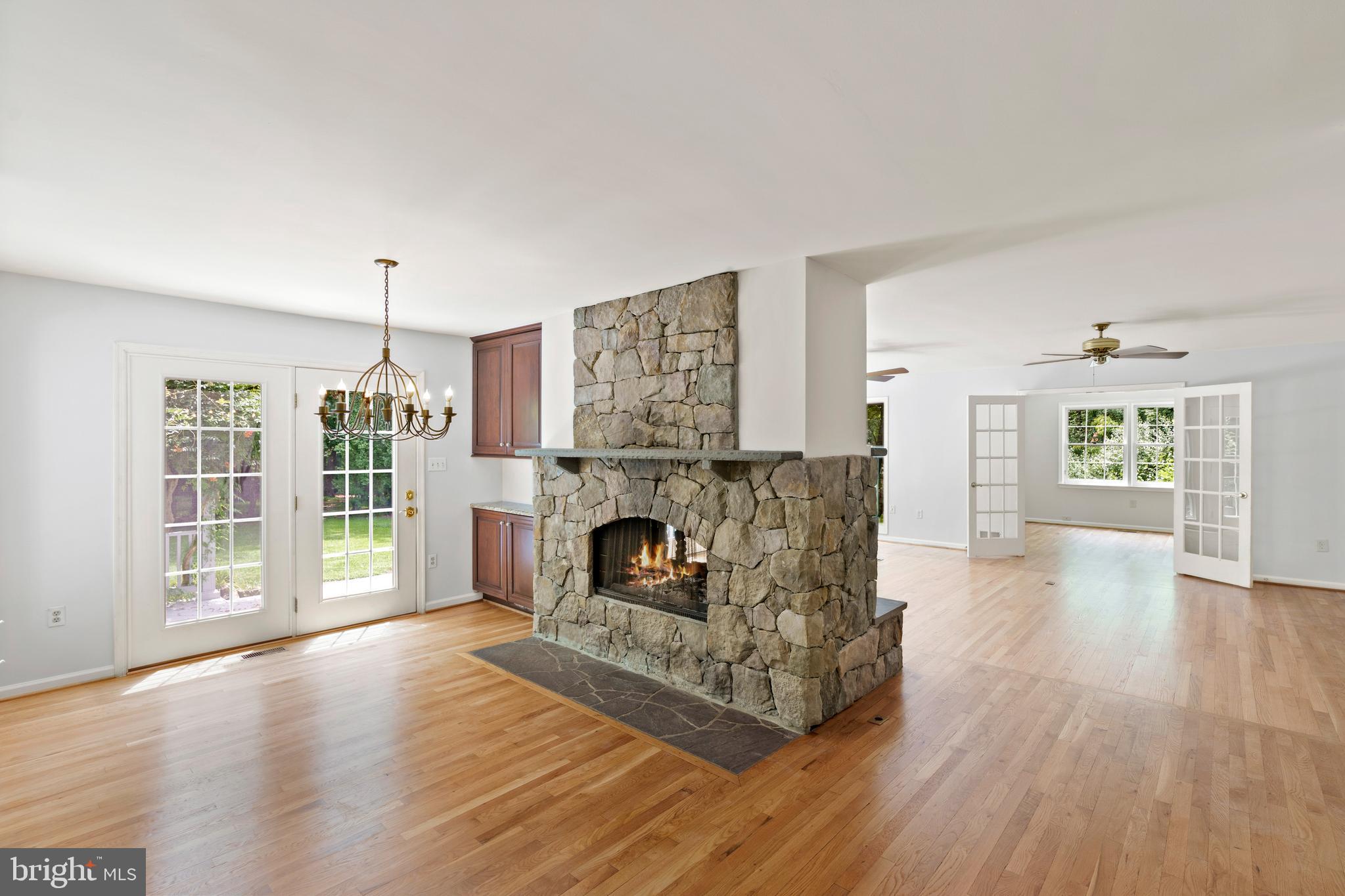 713 Clear Spring Road Great Falls, VA 22066 - Photo 12 of 41 Beautiful hearth anchors the home.