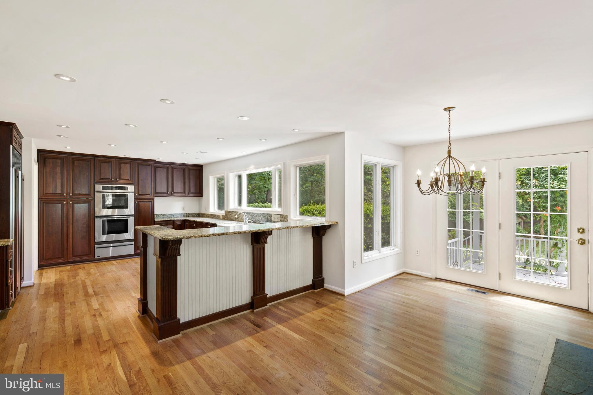 713 Clear Spring Road Great Falls, VA 22066 - Photo 13 of 41 French doors lead to the deck outside.