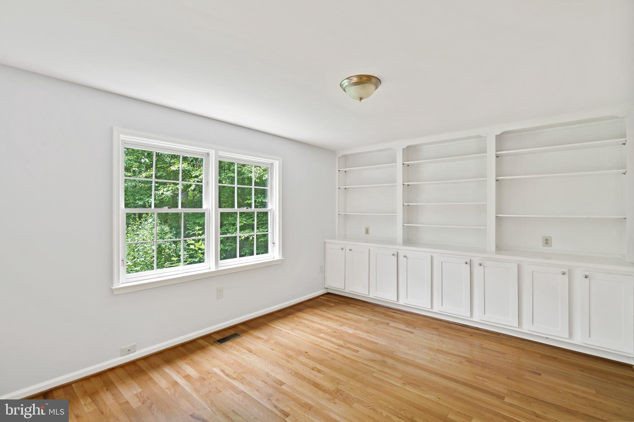 713 Clear Spring Road Great Falls, VA 22066 - Photo 16 of 41 Built-in shelving in the study/office