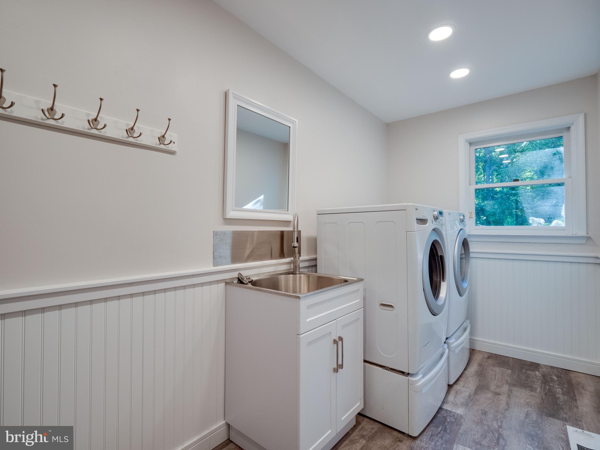 713 Clear Spring Road Great Falls, VA 22066 - Photo 23 of 41 Mud room with laundry room just off the garage.