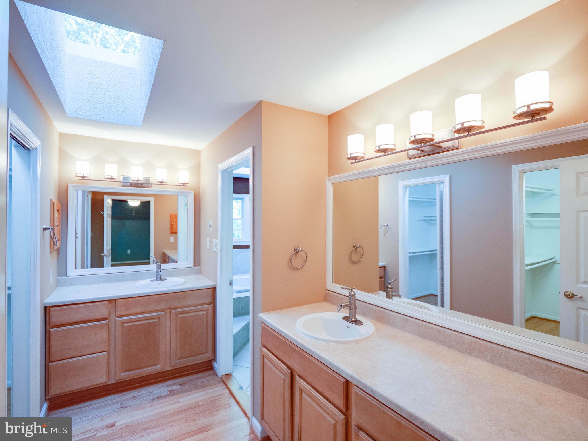 713 Clear Spring Road Great Falls, VA 22066 - Photo 26 of 41 Primary bath with 2 walk-in closets.