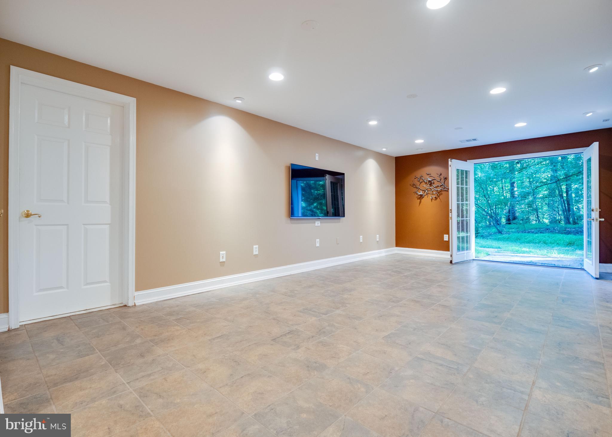 713 Clear Spring Road Great Falls, VA 22066 - Photo 35 of 41 Lower level walkout to side yard.