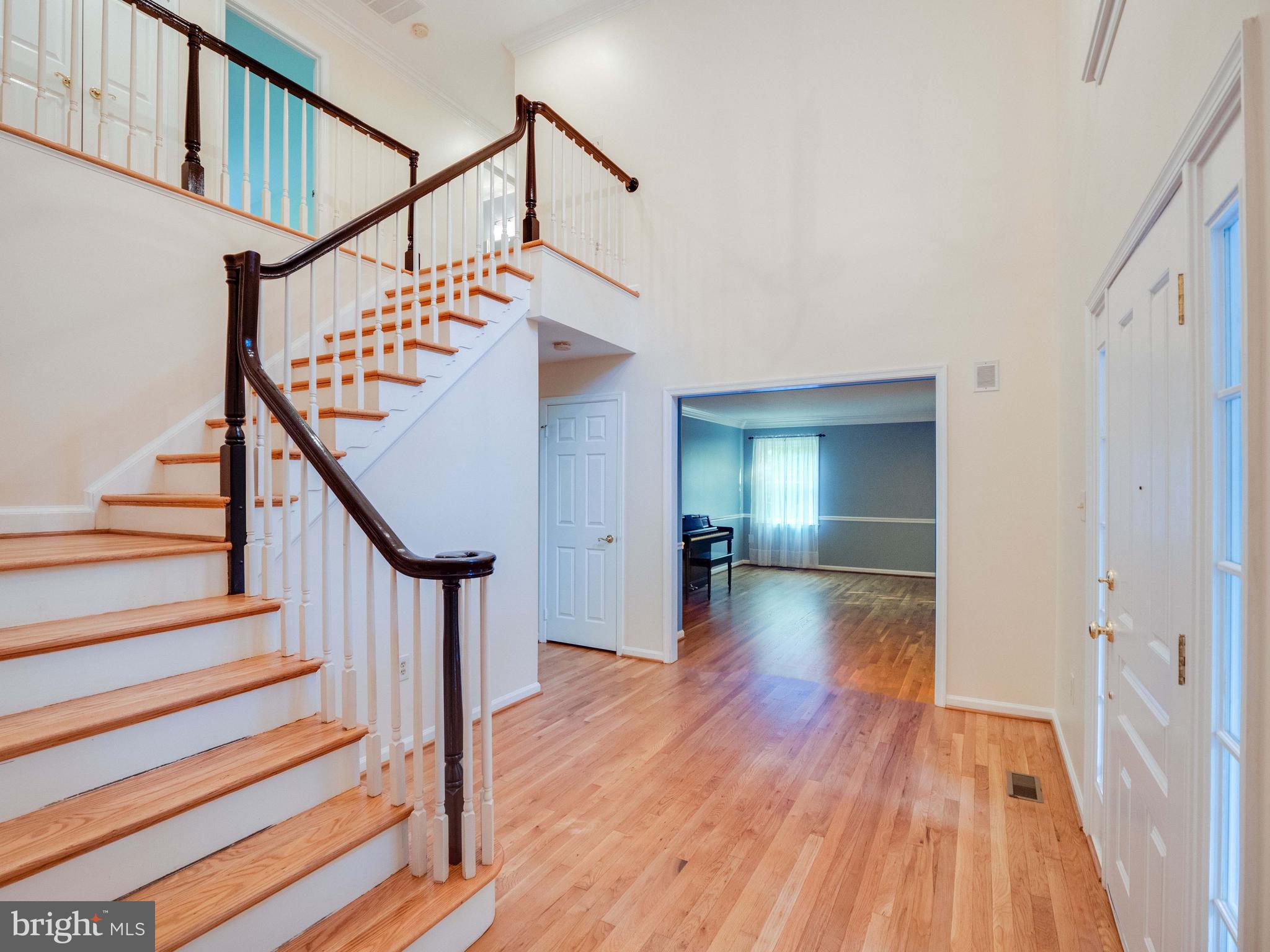 713 Clear Spring Road Great Falls, VA 22066 - Photo 6 of 41 Spacious foyer and staircase up to next level.
