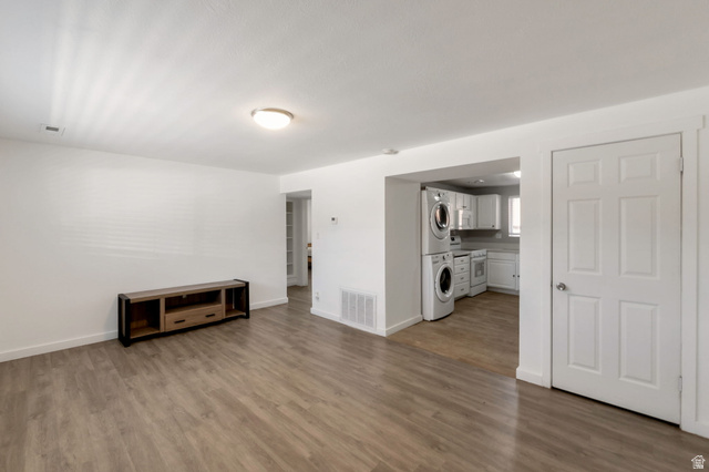 434 South 700 West, Unit 2 Provo, UT 84601 - Photo 5 of 15 Open-concept living space featuring wood-finish flooring, white baseboards, and a neutral color palette