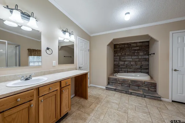 a bathroom with a sink double vanity and a mirror