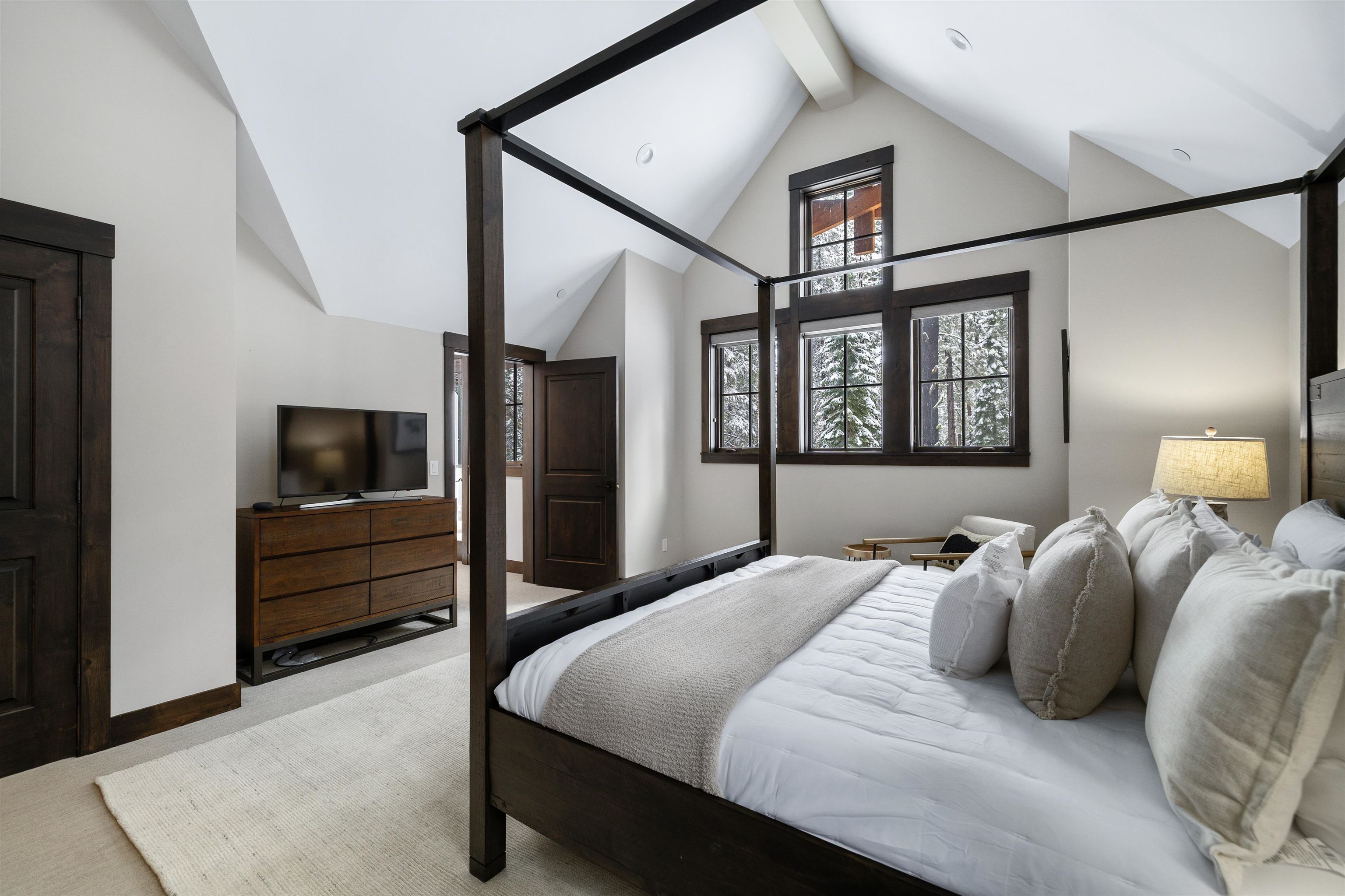 10601 Carson Range Road Truckee, CA 96161 - Photo 22 of 25 a bedroom with a bed and a tv on the dresser