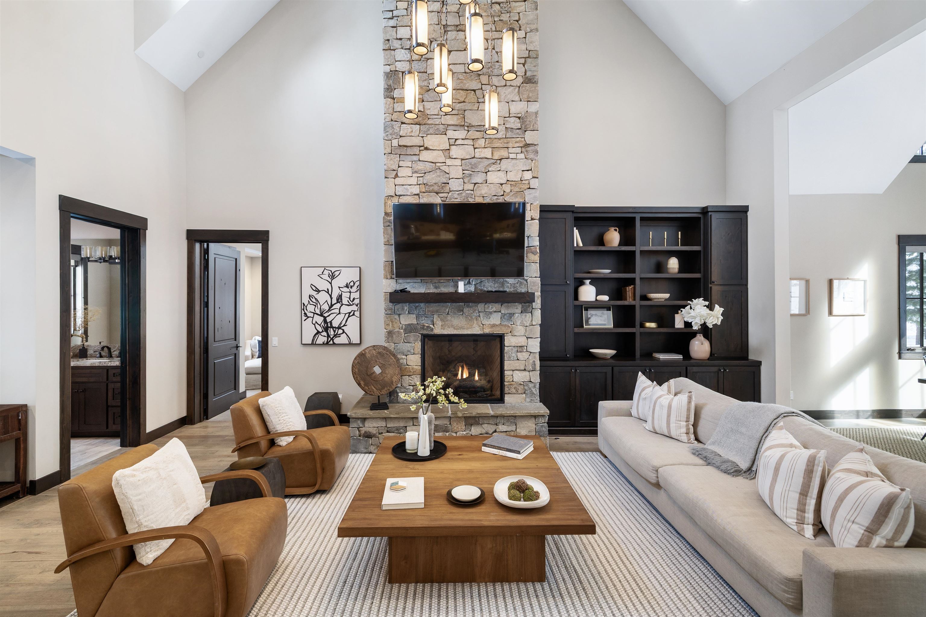 10601 Carson Range Road Truckee, CA 96161 - Photo 4 of 25 a living room with furniture a fireplace and a flat screen tv