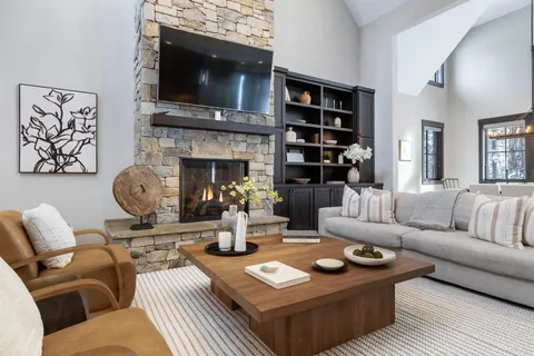 a kitchen with stainless steel appliances granite countertop wooden cabinets a stove and a sink