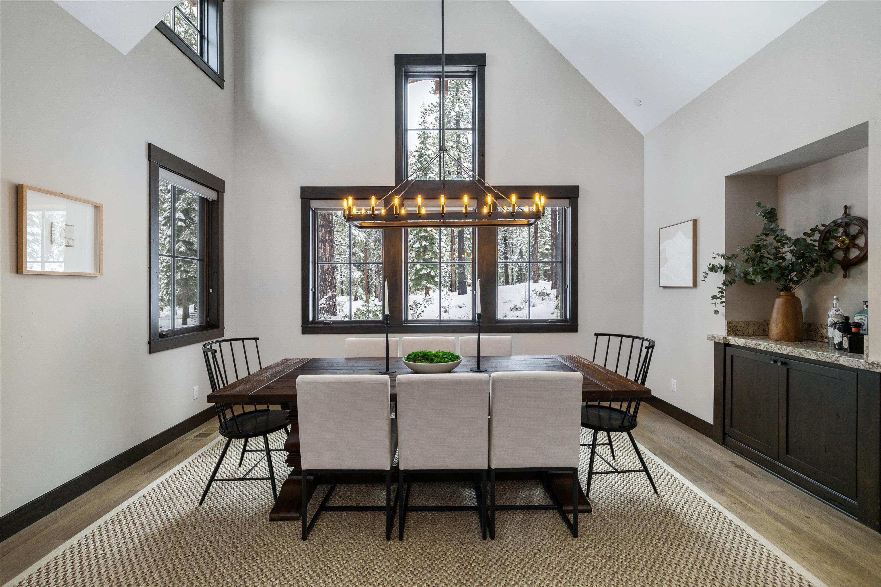 10601 Carson Range Road Truckee, CA 96161 - Photo 9 of 25 a view of a dining room with furniture window and wooden floor