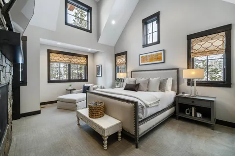 a bedroom with a bed and a fireplace