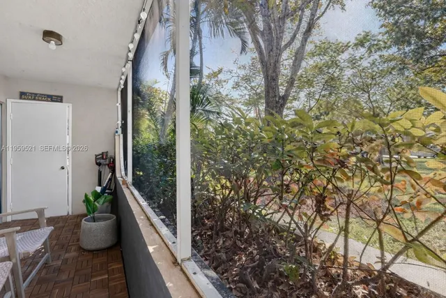 a view of balcony filled with furniture