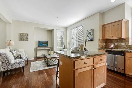 a view of living room with granite countertop furniture and fireplace