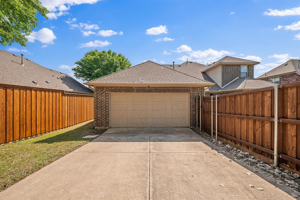 12809 Spring Hill Drive Frisco, TX 75035 - Photo 7 of 37 a front view of a house with a yard