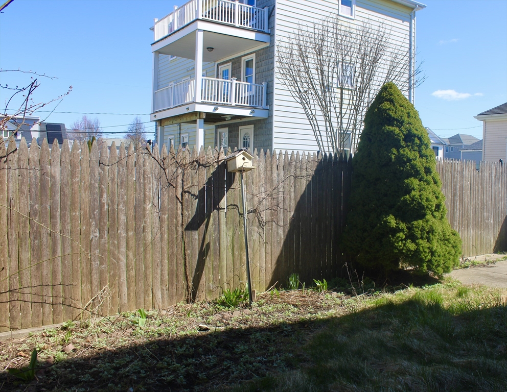 136 Horton Street, Unit 1 Fall River, MA 02723 - Photo 15 of 17 a front view of a house with a yard