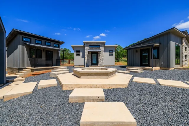 a view of an entryway with wooden floor and door