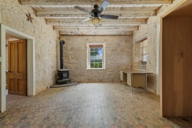 a view of a green field with lots of bushes