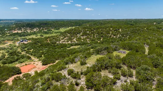 a kitchen with granite countertop a stove and a sink