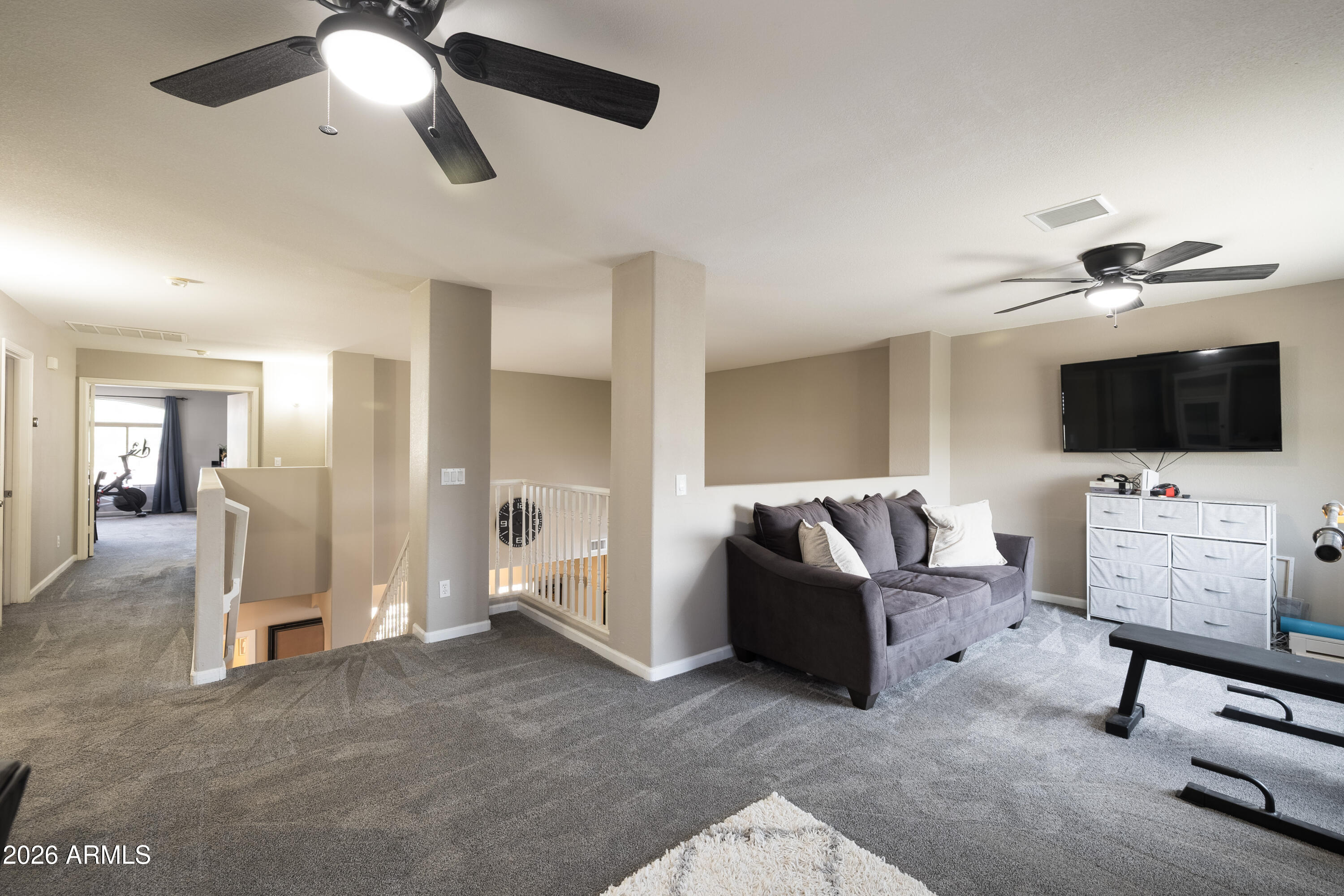 6407 West Saddlehorn Road Phoenix, AZ 85083 - Photo 28 of 41 a living room with furniture and a flat screen tv