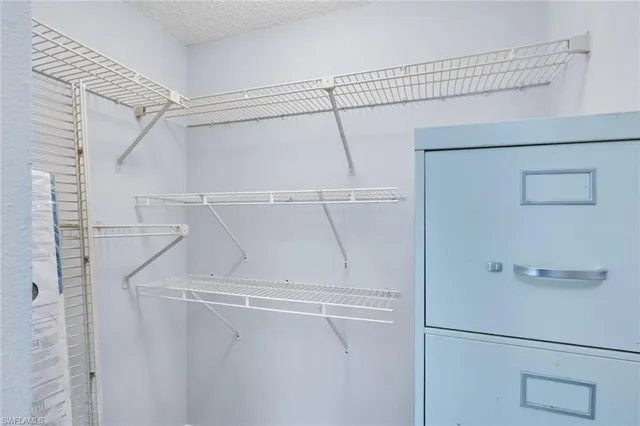 a view of a room with racks on the wall