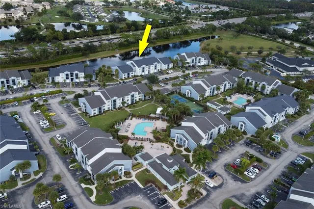 an aerial view of a house with a swimming pool yard and outdoor seating