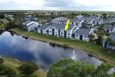 an aerial view of residential houses with outdoor space and river view