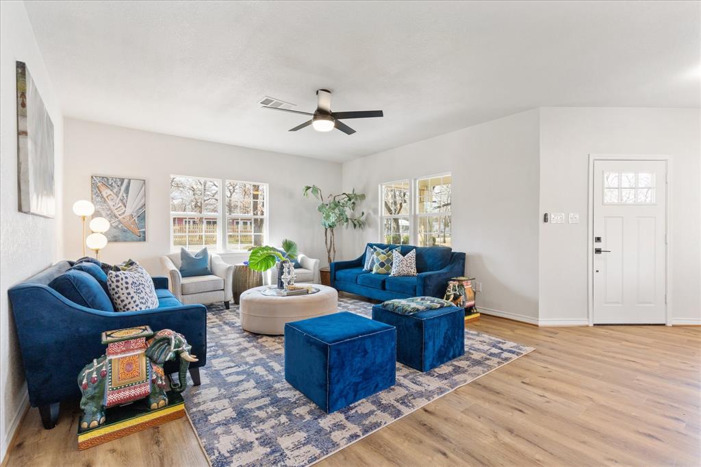 4309 Davis Road Granbury, TX 76049 - Photo 21 of 40 a living room with furniture and wooden floor