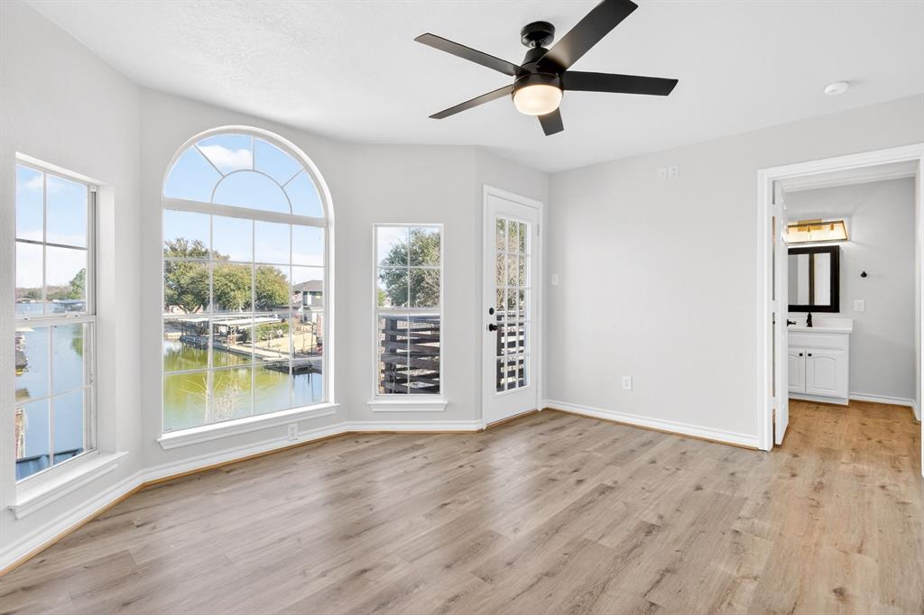 4309 Davis Road Granbury, TX 76049 - Photo 24 of 40 a view of an empty room with a window and wooden floor