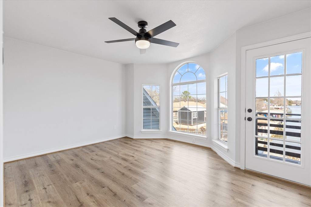 4309 Davis Road Granbury, TX 76049 - Photo 25 of 40 wooden floor in an empty room with a window
