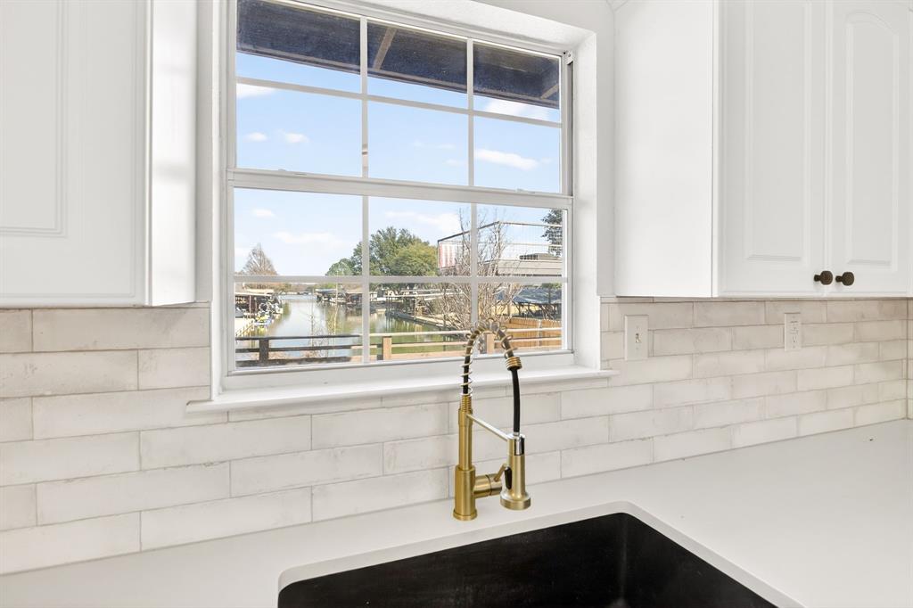 4309 Davis Road Granbury, TX 76049 - Photo 3 of 40 a bathroom with a sink and a large window