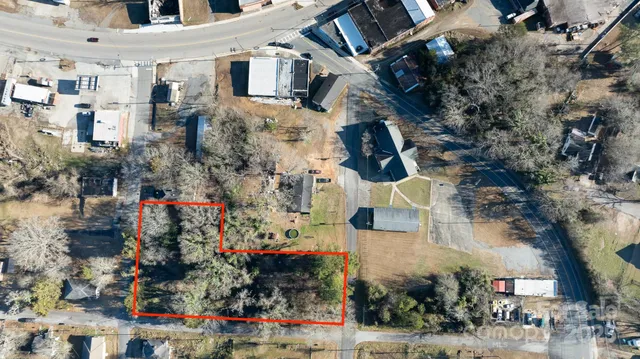 an aerial view of a house with outdoor space
