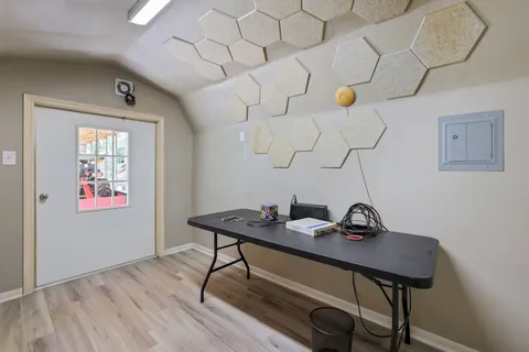 a view of a workspace with furniture