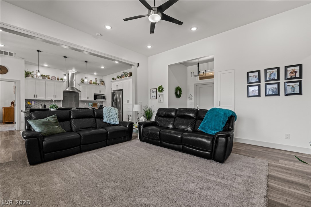 3020 Hannig Street Logandale, NV 89021 - Photo 75 of 75 An open floorplan seamlessly connects the living area to a chef's kitchen, fostering an inviting atmosphere.