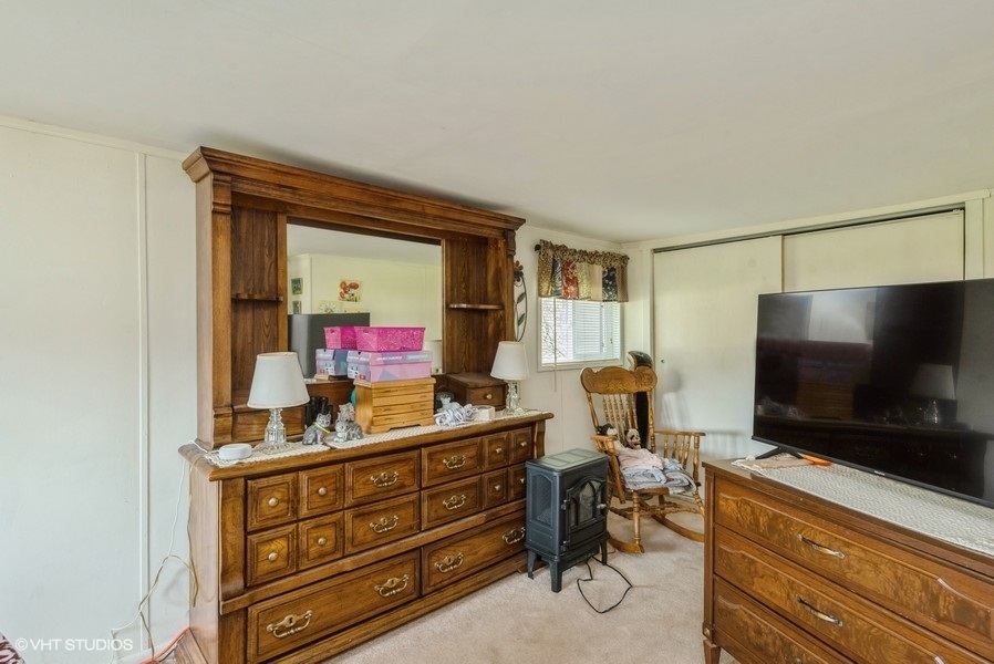 6002 Pine Street Harvard, IL 60033 - Photo 13 of 21 a living room with furniture and a flat screen tv